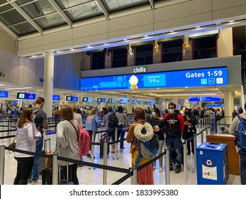 Orlando, FL/USA - 10/2/20:  People walking through the nearly empty security line at Orlando International Airport MCO.