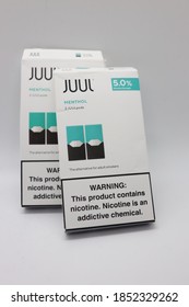 Orlando, FL/USA November 11th, 2020: Two Juul Menthol Pods Stack Together On A White Background.