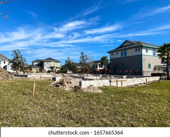 Orlando, FL/USA-2/10/20:  A New Home Concrete Block And Foundation Poured And Drying Awaiting The Construction Worker To Come And Start Framing The House.