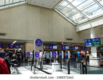 Orlando, FL/USA-8/22/19: Airport Security At A Busy International Airport With Clear, TSA Precheck And TSA Standard Screening.