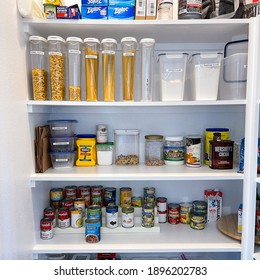 Orlando,FL USA - January10, 2021:  A home pantry that is organized with various products in put away in a tidy manner.