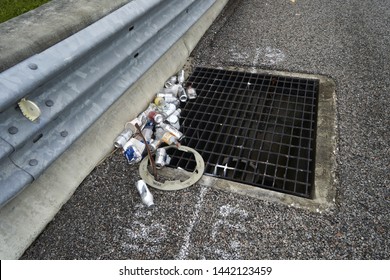         Orlando,Florida, June 2019, Trash In Storm Drain Gate Along Highway                    