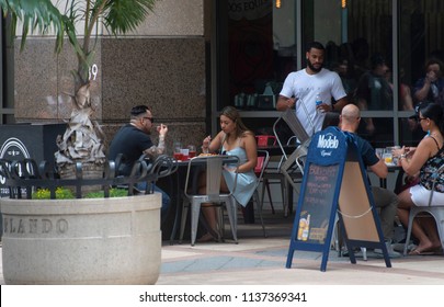 Orlando,FL/USA- 07/14/2018: Diners Enjoy Sunday Brunch Outdoors Near Orlando's Church Street.