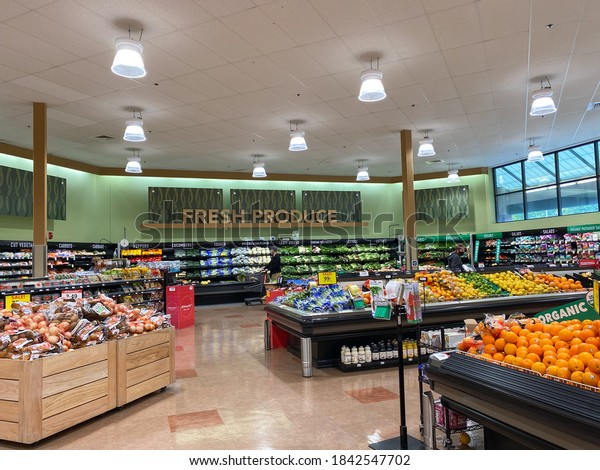 Orlando,FL/USA -10/2/20:  The fresh produce\
aisle of a Schnucks grocery store with colorful fresh fruits and\
vegetables ready to be purchased by\
consumers.