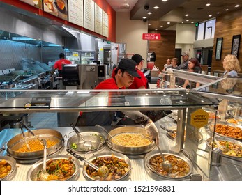 Orlando,FL/USA-10/2/19: Panda Express Chinese Fast Food Restaurant Employees Waiting On Customers.