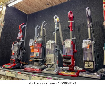 Orlando,FL/USA-11/11/19: A display shelf of vacuums for sale at a Home Depot store.