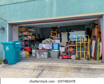 Orlando,FL/USA-11/13/19:  An unorganized garage filled with a lot of stuff in a neighborhood.