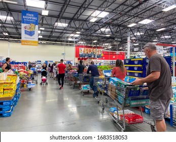 Orlando,FL/USA-3/14/20: Customers Standing In Long Lines Waiting To Check Out Their Groceries At A Sams Club In Orlando, Florida Due To The Hoarding Of Food And Supplies During The Coronavirus COVID19