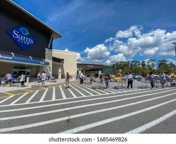 Orlando,FL/USA-3/14/20: Customers Standing In Long Lines Waiting To Get Into  A Sams Club In Orlando, Florida Due To The Hoarding Of Food And Supplies During The Coronavirus COVID-19 Pandemic.