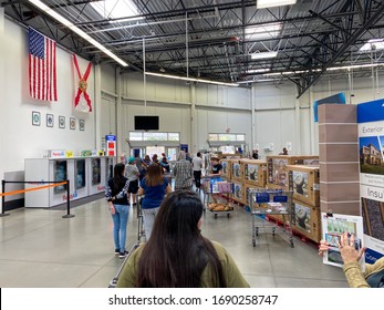 Orlando,FL/USA-3/14/20: Customers Standing In Long Lines Waiting To Get Out Of A Sams Club In Orlando, Florida Due To The Hoarding Of Food And Supplies During The Coronavirus COVID-19 Pandemic.