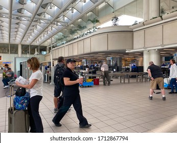 Orlando,FL/USA-3/21/20:  People Going Through Orlando International Airport MCO TSA Security On A Slow Day Due To The Coronavirus.