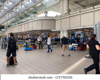 Orlando,FL/USA-3/21/20:  People Going Through Orlando International Airport MCO TSA Security On A Slow Day Due To The Coronavirus.