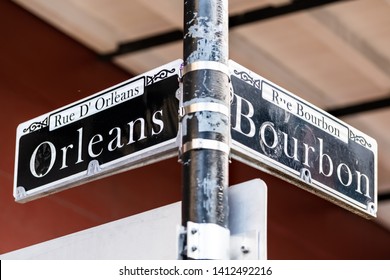 Orleans And Bourbon Intersection Streets Sign Text In New Orleans On Lamp Pole Post Isolated Closeup