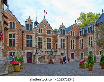 ORLEANS, FRANCE - MAY 11, 2017: Courtyard of Hotel Groslot, which is now Loiret city hall, with statue of Joan of Arc in prayer
