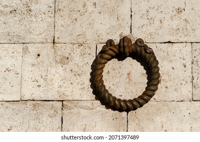 Ornament Of A Palace, Wrought Iron Ring On A Facade Of A Building. Zero Symbol, Round, Circle, Hook, Iron Ring.