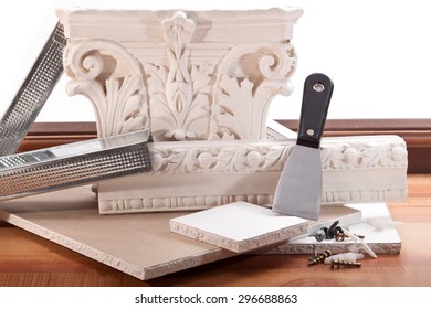 Ornament Of Plaster, Dry Wall, Trowel, Screws, Dowels And Parquet