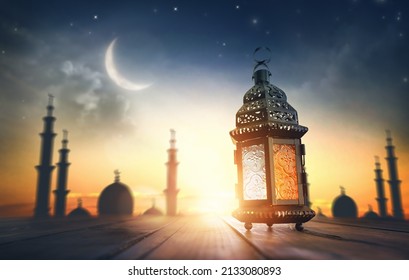Ornamental Arabic lantern with burning candle glowing at night. Festive greeting card, invitation for Muslim holy month Ramadan Kareem. - Shutterstock ID 2133080893