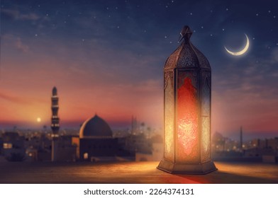 Ornamental Arabic lantern with burning candle glowing at night mosque background. Festive greeting card, invitation for Muslim holy month Ramadan Kareem.