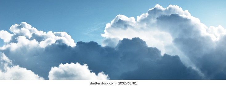 Ornamental clouds. Dramatic sky. Epic storm cloudscape. Soft sunlight. Panoramic image, texture, background, graphic resources, design, copy space. Meteorology, heaven, hope, peace concept - Shutterstock ID 2032768781
