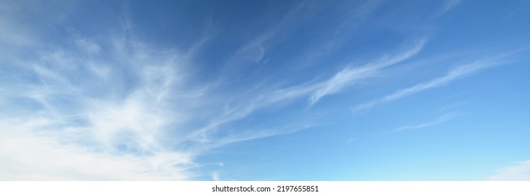 Ornamental clouds. Dramatic sky. Epic storm cloudscape. Soft sunlight. Panoramic image, texture, background, graphic resources, design, copy space. Meteorology, heaven, hope, peace concept - Shutterstock ID 2197655851