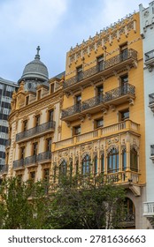 Ornamental facade details of Edificio Noguera and Casa Ernesto Ferrer on Valencia City Hall square, Spain