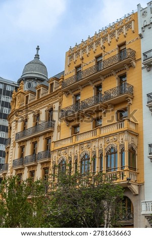 Ornamental facade details of Edificio Noguera and Casa Ernesto Ferrer on Valencia City Hall square, Spain