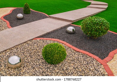 Ornamental Garden With Ornamental Granulate Stainless Steel Balls And Garden Path Made Of Pink Granite