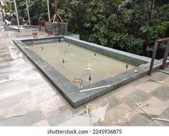 ornamental pond in the outside area, has been completed.  Just clean it and fill it with clean water. - Shutterstock ID 2245936875
