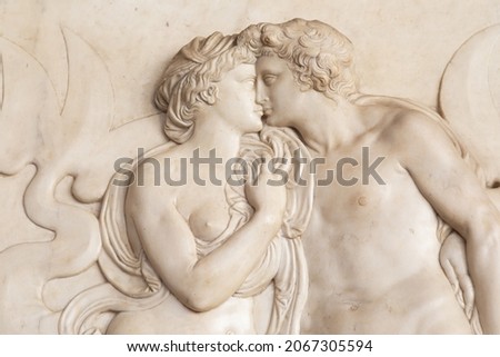 Ornamental relief of a fountain in Florence, Italy. Ancient sculpture with kissing couple. Florentine art 16th Cent. Сток-фото © 