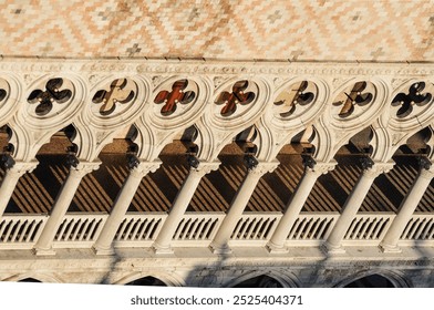 Ornate arches cast elegant shadows on historic Venetian building facade - Powered by Shutterstock