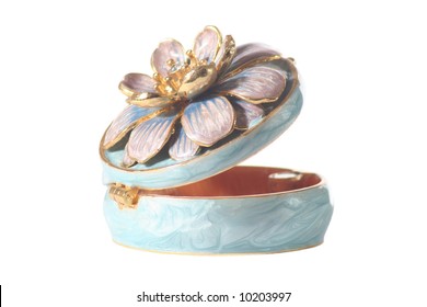 Ornate, Blue Enamalled Pil Box Decorated With A Flower On The Lid