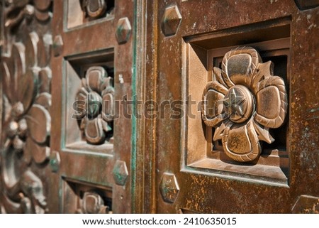 Ornate Bronze Door Detail with Flower Relief in Indianapolis