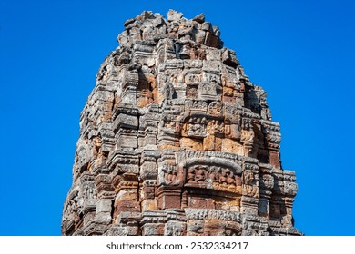 An ornate carved stone tower on the 11th century Wat Phnom Banan, Banan, Cambodia - Powered by Shutterstock