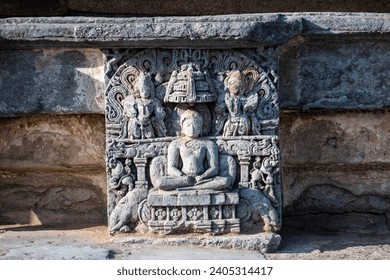Ornate carvings of a meditating deity at the ancient Hoysala era Chennakeshava temple in Belur, Karnataka. - Powered by Shutterstock