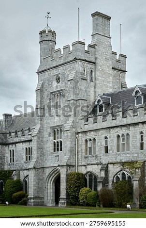 The ornate clock tower and limestone Gothic Revival architecture of the Main Quadrangle at University College Cork, Cork City, County Cork, Ireland.