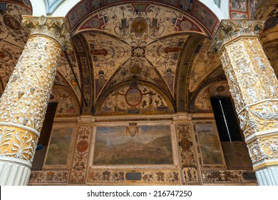 Ornate courtyard of Palazzo Vecchio, Florence, Italy. Palace building is landmark of Florence. Luxury interior of old Palazzo Vecchio. Renaissance painting, fresco, ornament inside Palazzo Vecchio.