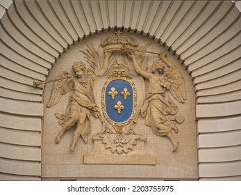 Ornate detail of Porte de Paris, with fleur-de-lis coat of arms historic city gate of Lille, France 