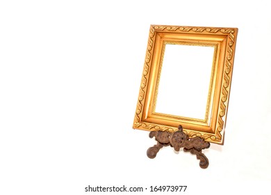 Ornate Gold Picture Frame On Vintage Metal Stand