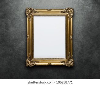 Ornate golden frame at the concrete wall with clipping path for the inside