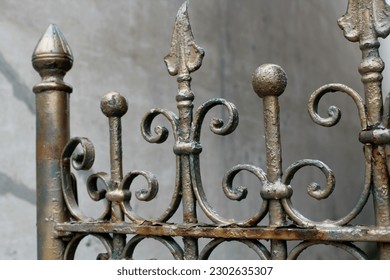 An ornate iron cemetery gate.