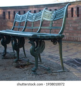 An Ornate Old Blue Bench With Delicate Pattern. A Beautiful Fancy Seat By A Street Cafe Or Restaurant. Stock Photography.