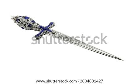 Ornate silver dagger with blue lapis lazuli gemstones and intricate filigree handle