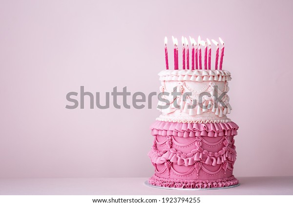 Ornate vintage buttercream birthday cake with\
buttercream ruffles and\
frills