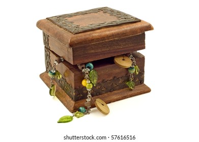 Ornate, Wooden Jewelry Box Overflowing With Jewelry.  Isolated On White.