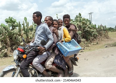 Oromia Region, Ethiopia - May 16, 2019: Ordinary people, family travel on bike in Ethiopian countryside. Everyday life on Ethiopia, Oromia Region, Ethiopia, Africa