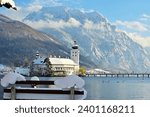 The Ort lake castle on an island on Lake Traunsee in Gmunden in winter with snow