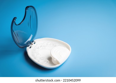 Orthodontic Care, New Invisible Plastic Aligners Printed On A 3d Printer Lie In A Special White Box, On A Blue Background Without People