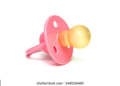 Orthodontic pacifier isolated on a white. Pink baby's pacifier isolated on white background.