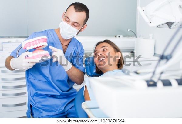 Orthodontist is\
telling about hygiene in\
hospital