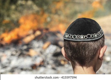 Orthodox child celebrate by a bonfire the Jewish holiday of Lag Baomer, a festive day on the Jewish calendar to commemorate the death of Rabbi Shimon Bar Yochai.